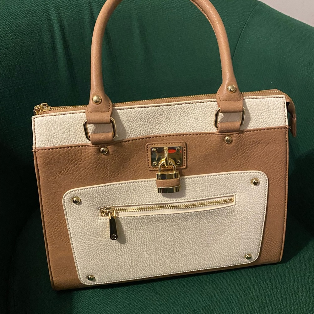 New Charming Charlie’s Tan and White purse.